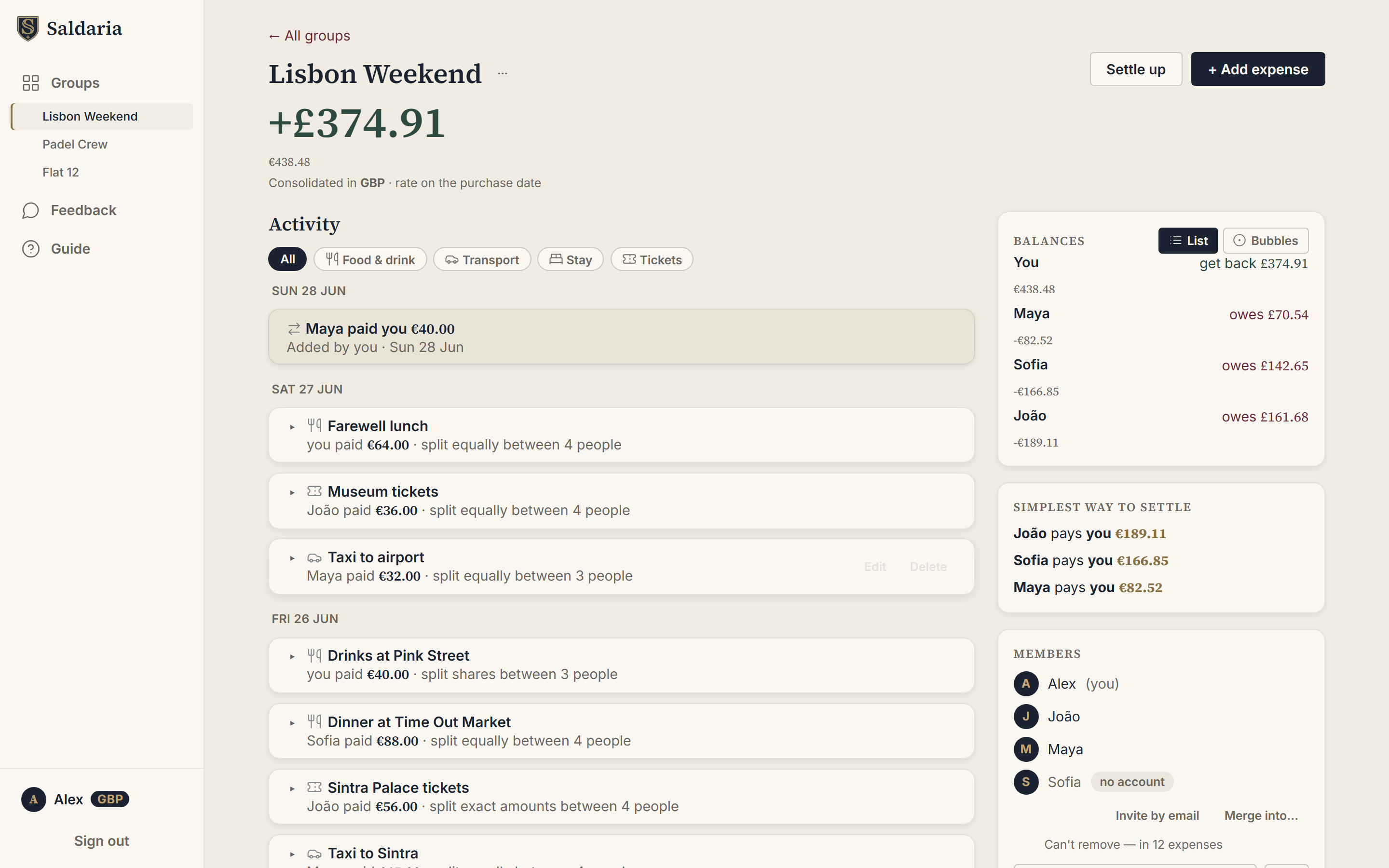A Saldaria group called Lisbon Weekend on desktop: a positive balance of £374.91 consolidated in pounds from euro expenses, an activity feed of split expenses, per-person balances, and a simplest-way-to-settle panel reducing the trip to three payments.